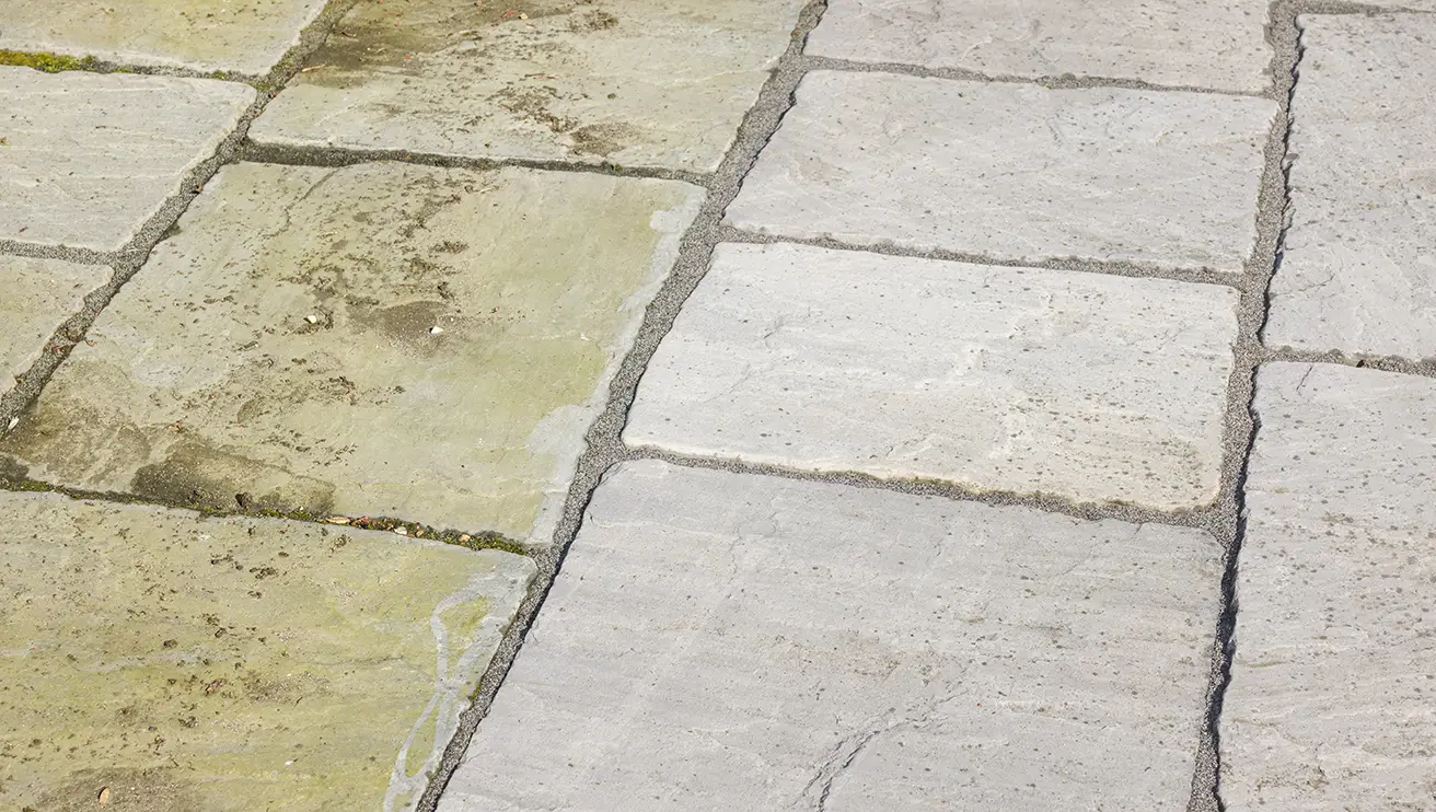 Before and after of cleaning sandstone paving.