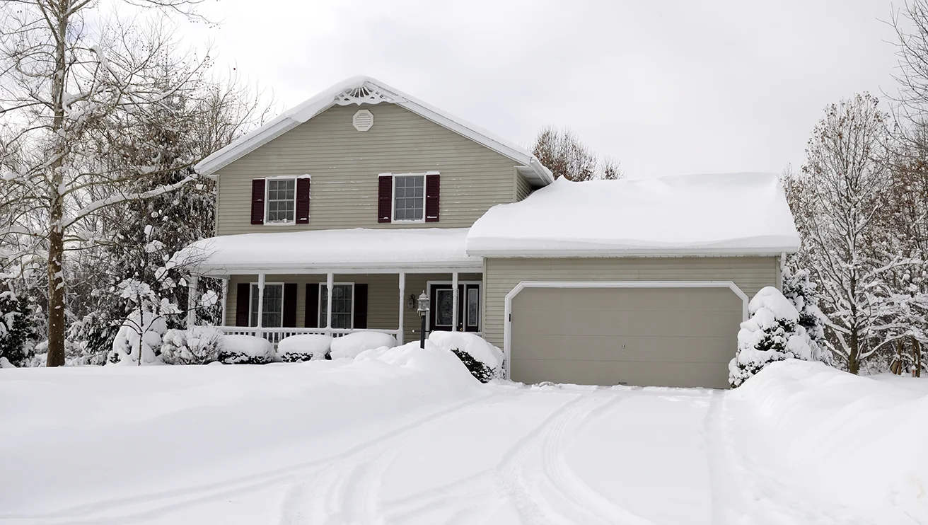 A house in winter covered in snow.