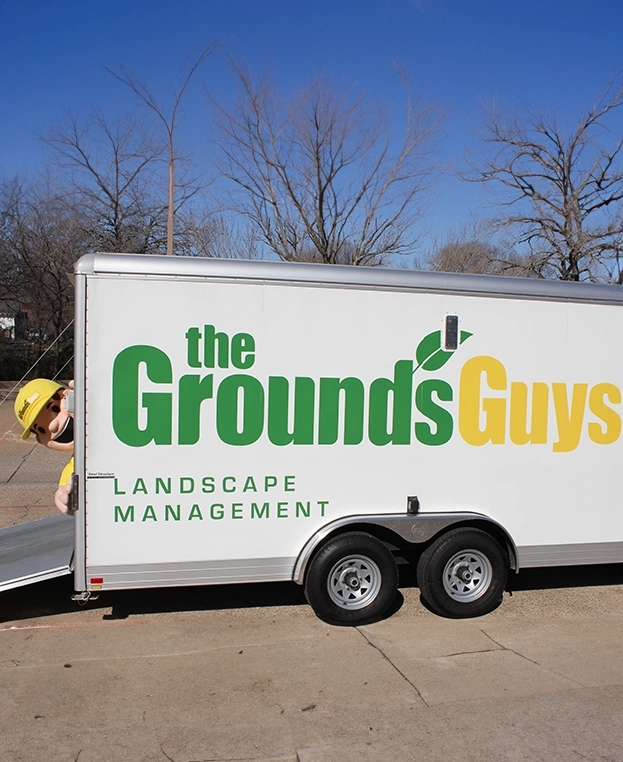 The Grounds Guys branded trailer.