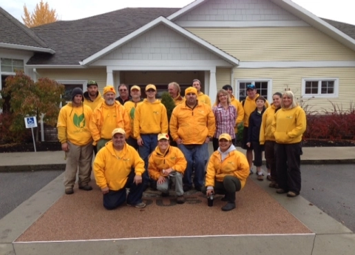 The Grounds Guys of Okanagan and Shuswap posing in front of a house on WeCare Day.